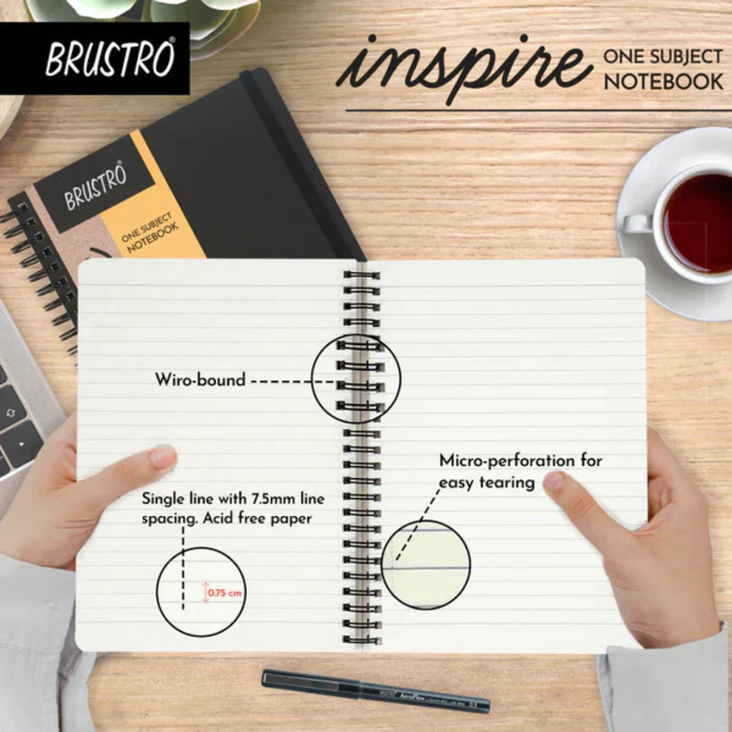 Brustro 'Inspire' one subject notebook with diagram on a wooden surface.