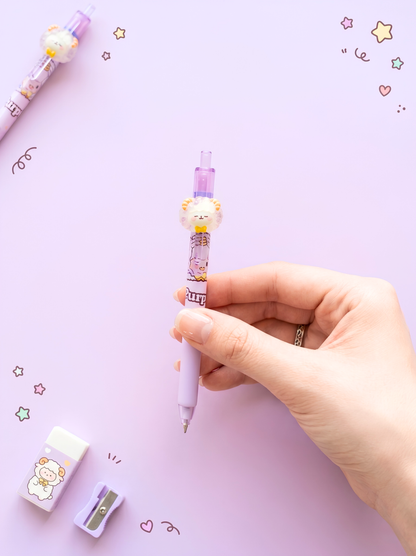 Hand holding a pink pen with a cute design on a light purple background