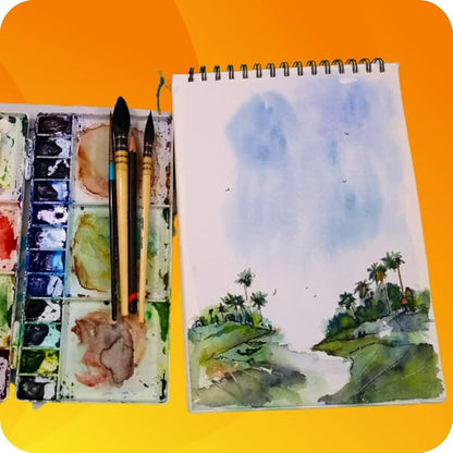 Artistic setup with watercolor paints, brushes, and a landscape painting on an orange background