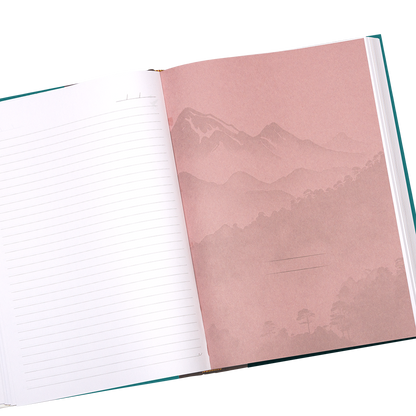 Open notebook with a pink page featuring a mountain landscape design.