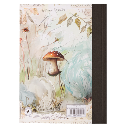 Notebook with a mushroom and nature-themed cover on a white background