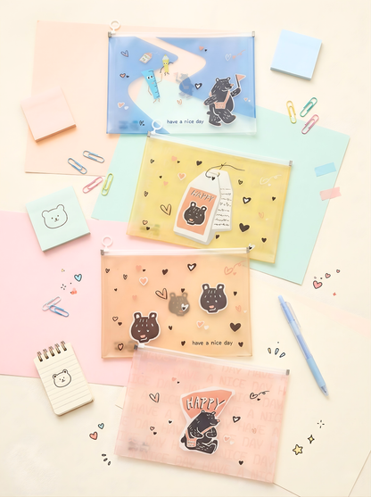 Collection of cute stationery items with bear illustrations on a light background