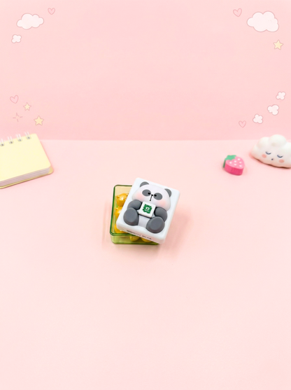 Cute panda-shaped eraser on a pink background with decorative elements