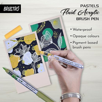 Hand holding a fluid acrylic brush pen over a card with floral design, with BRUSTRO branding.