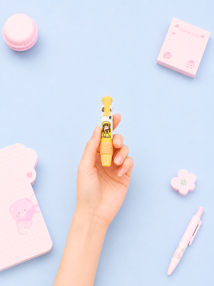 Hand holding a small yellow toy with a pink background