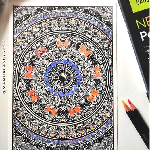 Mandala coloring book with colored pencils on a white background