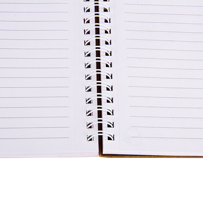 Close-up of a notebook with a spiral binding and lined pages.