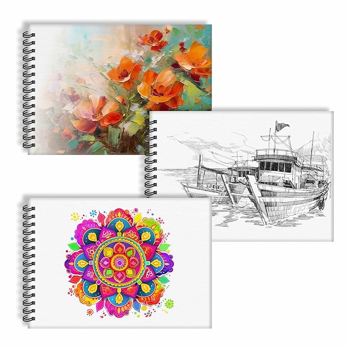 Three spiral-bound notebooks with different designs on a white background
