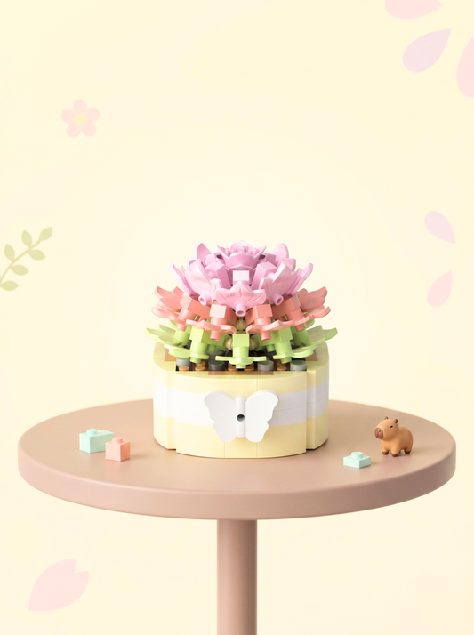 Pastel-colored toy cake with flowers on a small round table against a light yellow background