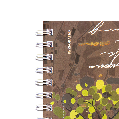 Notebook with nature-themed design and 'Perforated' text on a white background