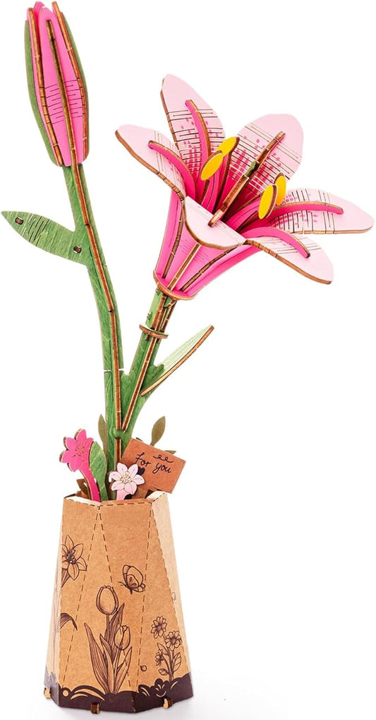 Decorative paper flower arrangement with a wooden vase on a white background