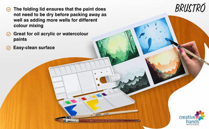 BRUSTRO art set with paint mixing tray and watercolor paintings on a wooden surface.