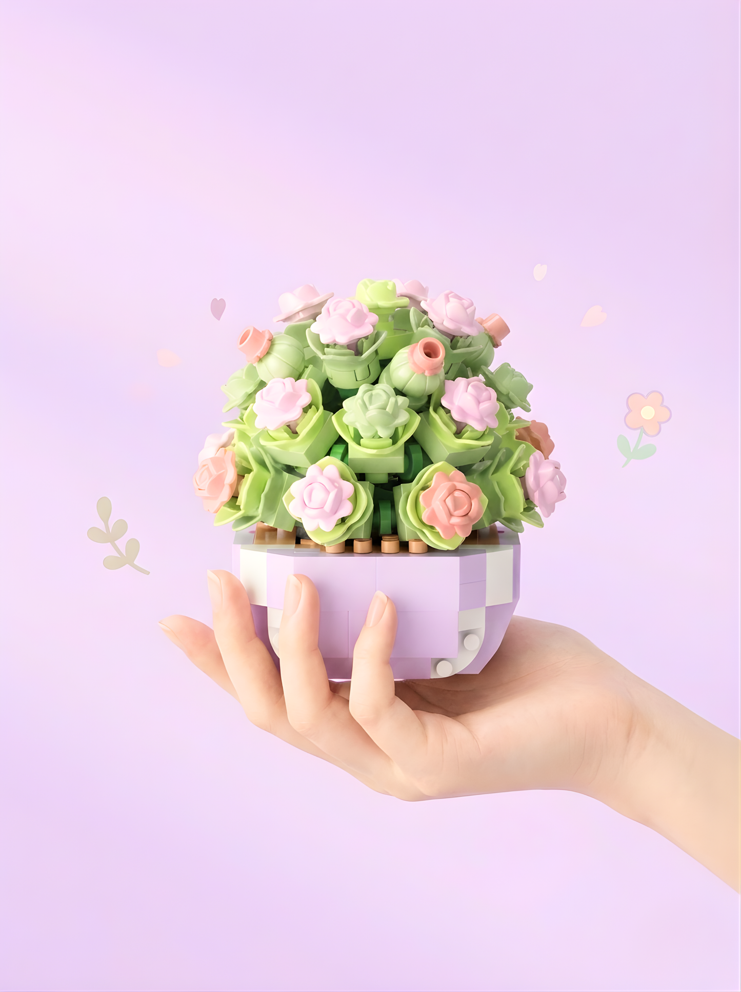 Hand holding a small decorative plant with pink flowers against a light purple background
