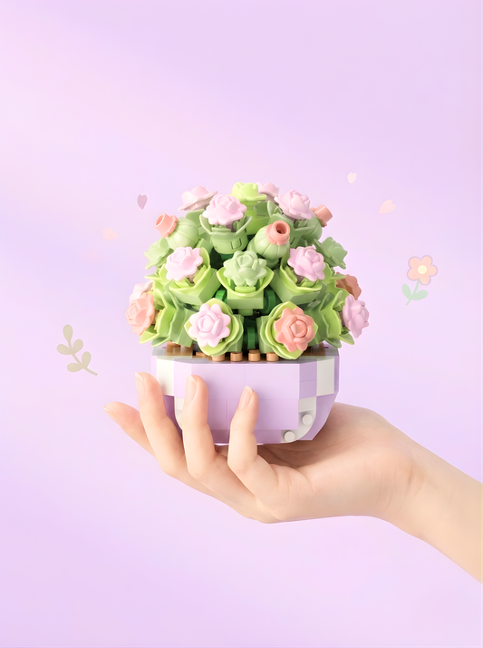 Hand holding a small decorative plant with pink flowers against a light purple background