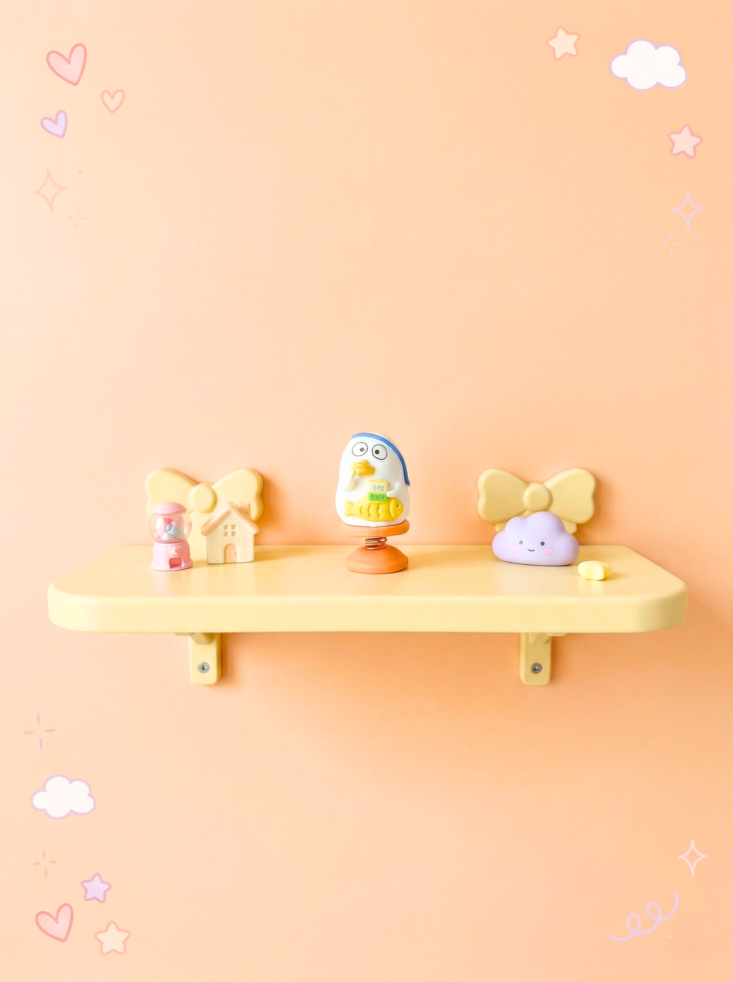 Yellow shelf with decorative items against a peach-colored wall with cloud and star decorations.