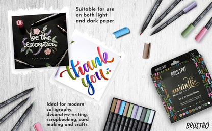 Brustro metallic markers with cards and packaging on a wooden surface