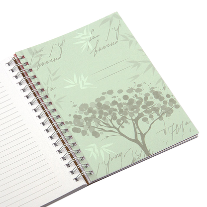 Notebook with tree design on cover and white pages
