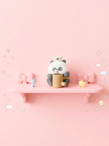 Toy panda on a pink shelf with a pink background