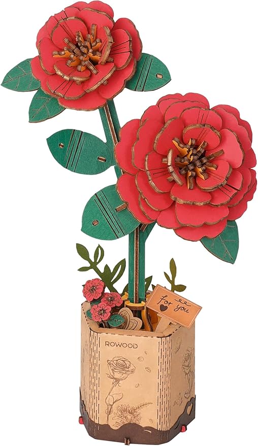 3D paper flower model with red flowers and green leaves on a white background