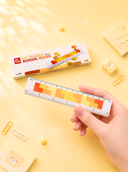 Hand holding a ruler with a colorful design on a yellow background