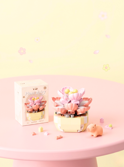 Decorative planter with pink flowers on a pink table against a light yellow background