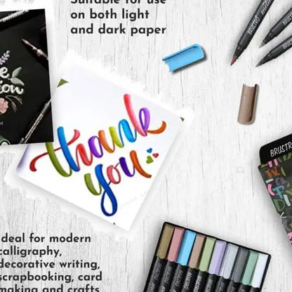 Colorful 'thank you' card with markers and a rubber on a white surface