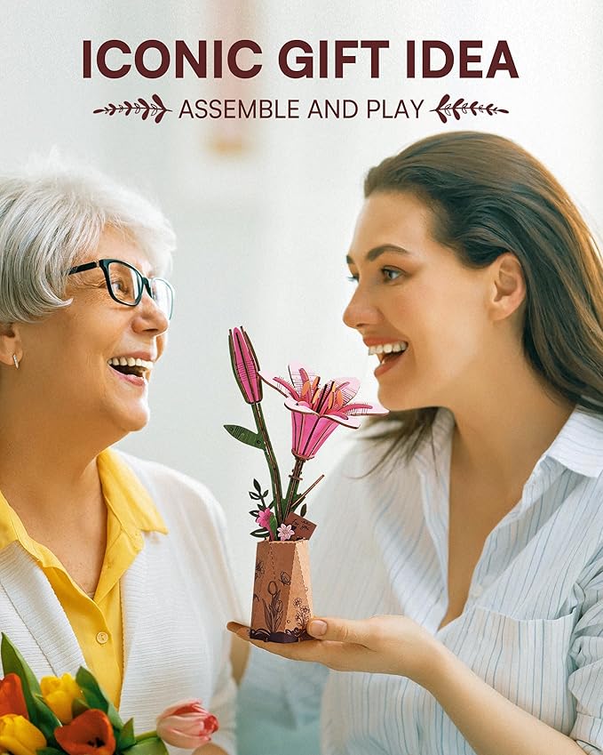 Two women smiling at each other with flowers, promotional text for 'Iconic Gift Idea'.
