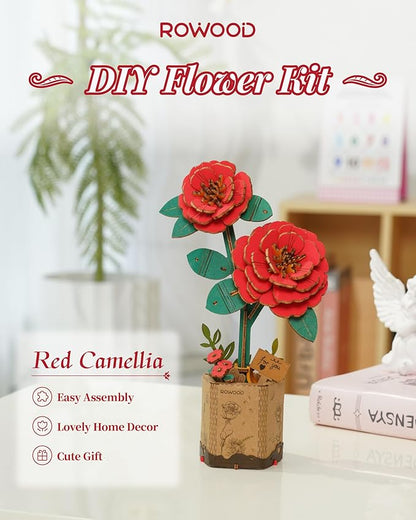 Red Camellia DIY flower kit by ROWOOD on a white surface with a blurred background