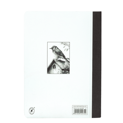 Notebook with a black and white illustration of a bird on the cover against a green background