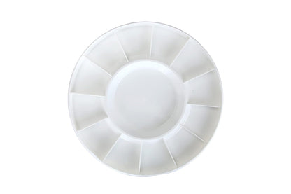 White plastic palette with multiple compartments on a white background