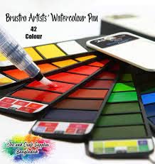 Set of watercolor pans with a brush and packaging on a white background
