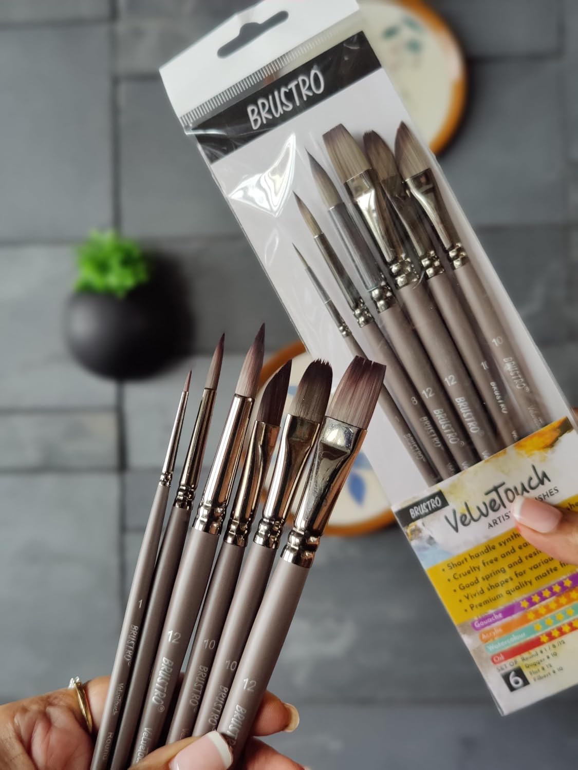 Set of BRUSTRO painting brushes in packaging with a blurred background