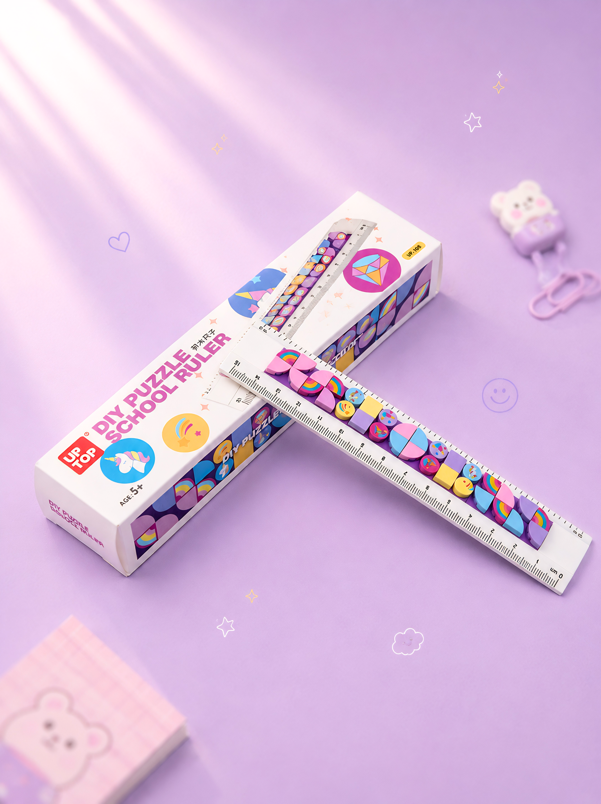 Colorful DIY puzzle ruler with packaging on a purple background