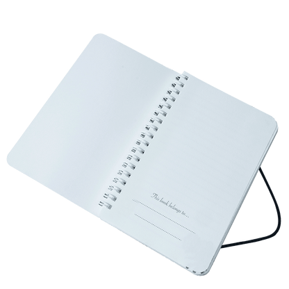 White notebook with spiral binding on a transparent background