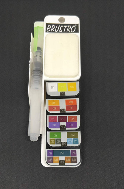 Brustro watercolor set with pan colors and a brush on a dark background