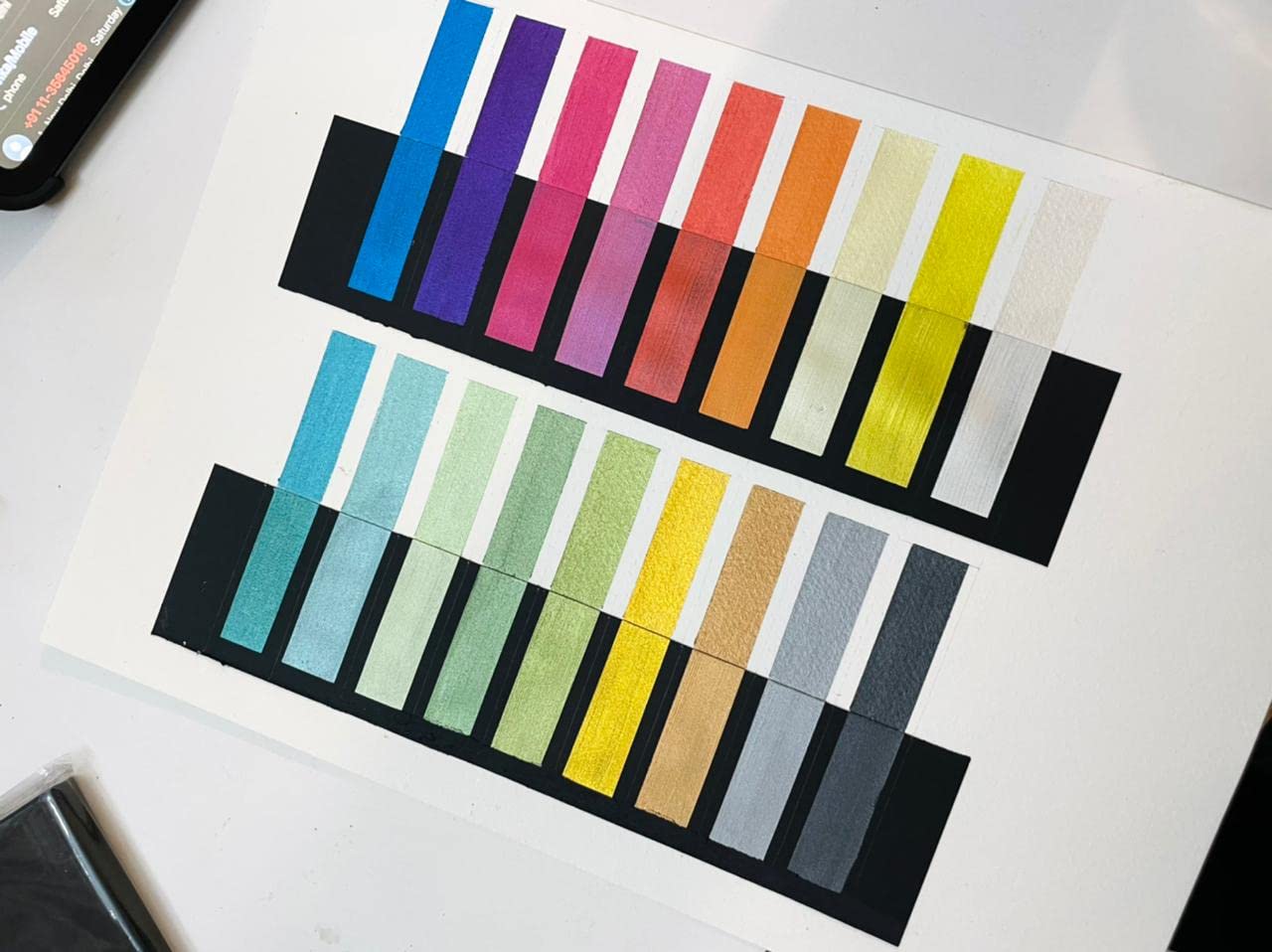 Color swatch chart with various colors on a white background
