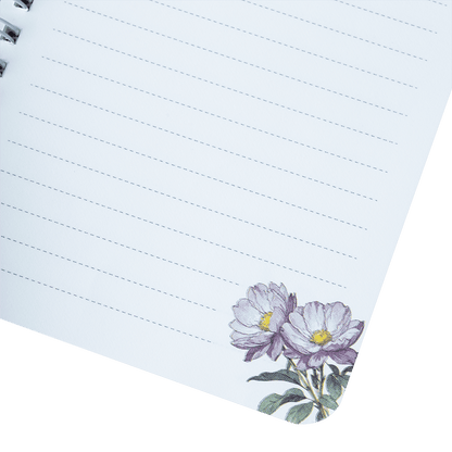 Notebook page with floral design on a green background