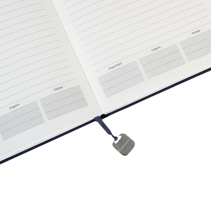 Open notebook with labeled sections and a visible brand tag on a white background