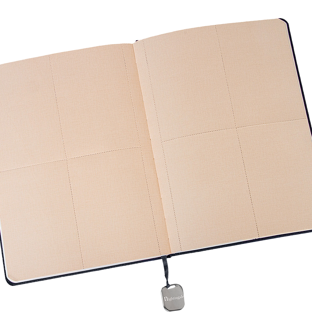 Beige quilted notebook with a visible brand logo on a white background