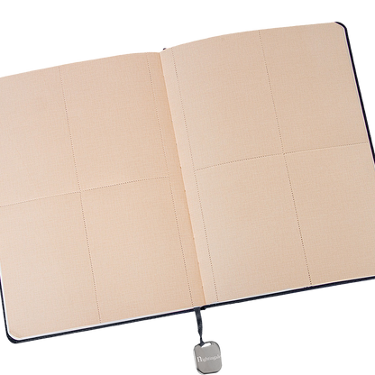 Beige quilted notebook with a visible brand logo on a white background