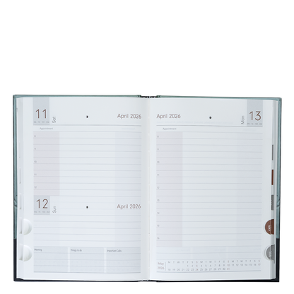 Open planner showing a two-page spread with calendar and notes sections for April 2026.