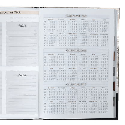 Open planner showing calendar pages for 2025, 2026, and 2027.