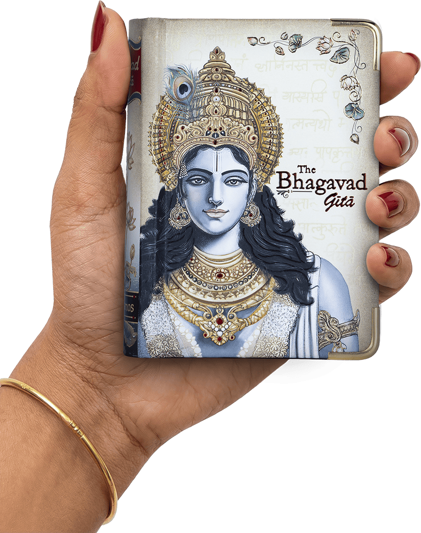 Hand holding a book titled 'The Bhagavad Gita' with an illustration of a deity on the cover.
