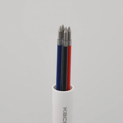 Three drill bits in a white holder on a gray background