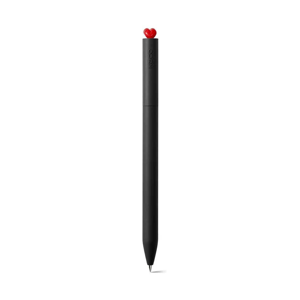 Black pen with a red heart-shaped clip on a white background