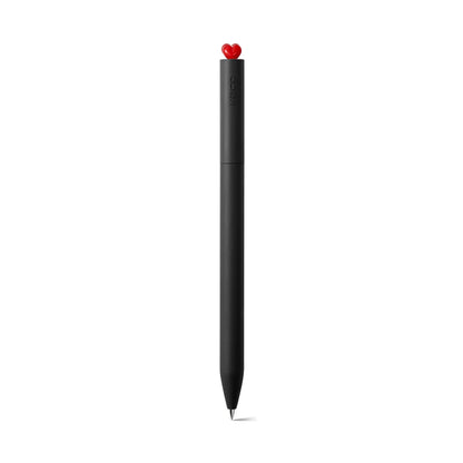 Black pen with a red heart-shaped clip on a white background
