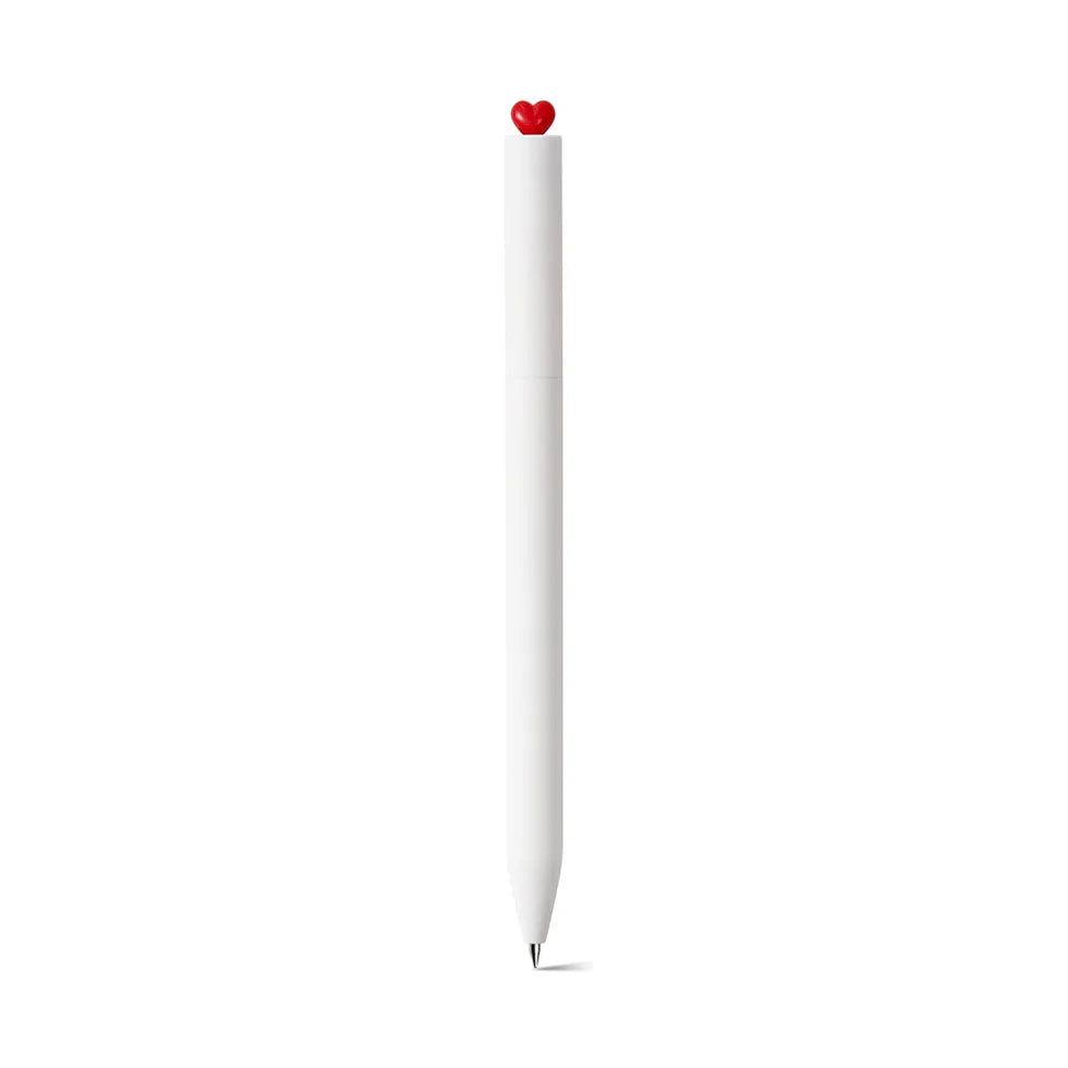 White pen with a red heart-shaped cap on a white background