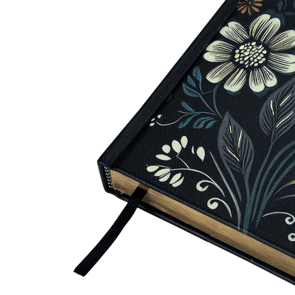 Floral design notebook with a black cover on a transparent background