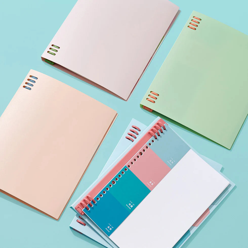 Colorful notebooks on a light blue background
