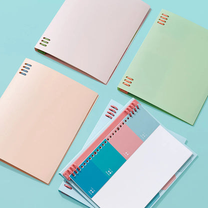 Colorful notebooks on a light blue background